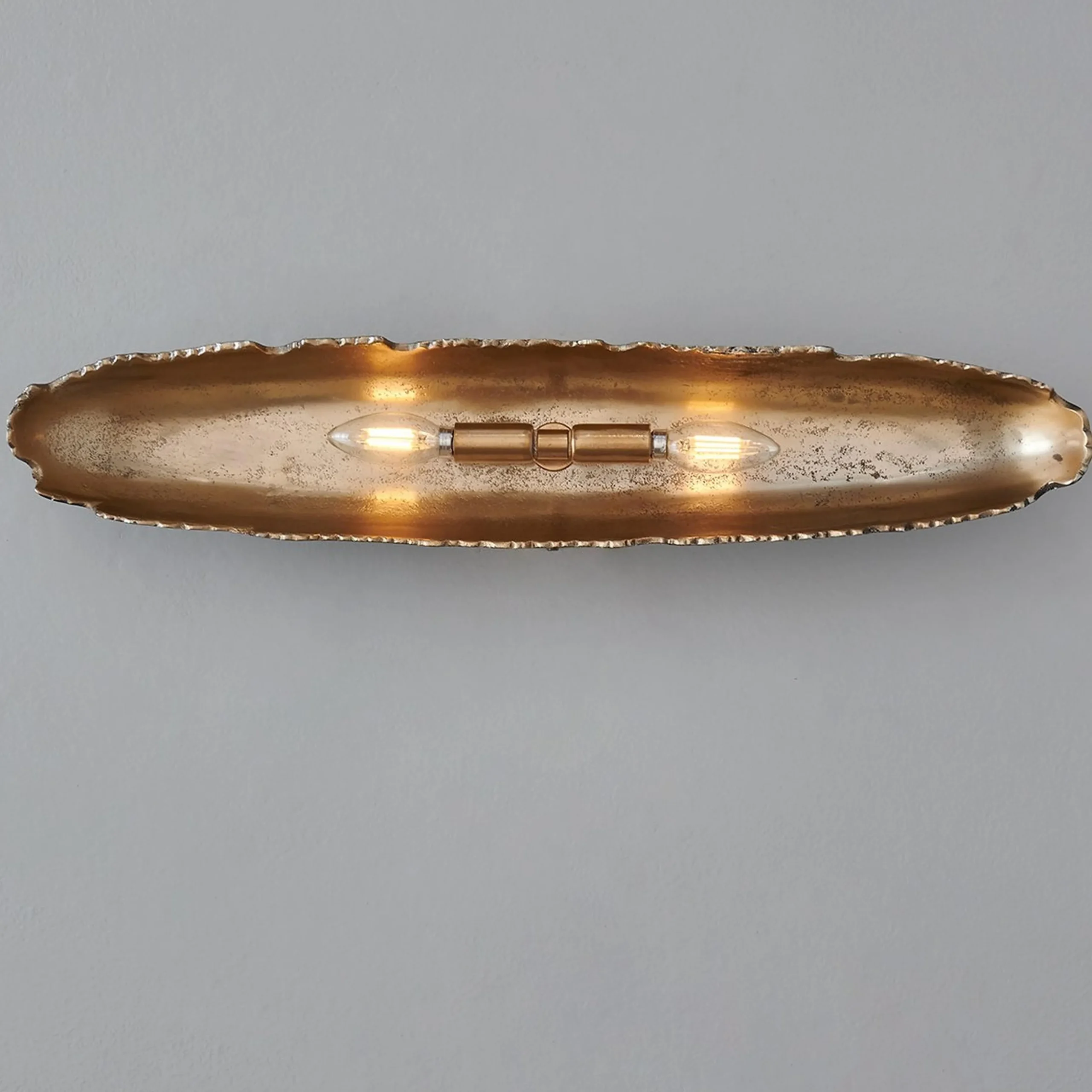 Oumaumau Sconce